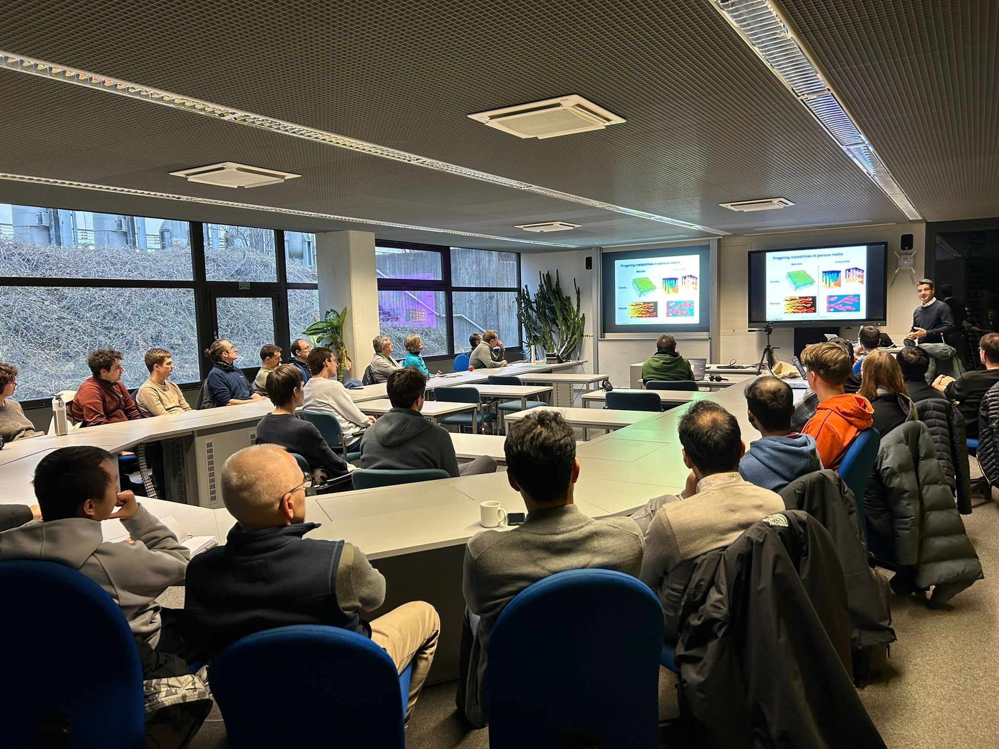 Ruben Juanes holding lecture in conference room