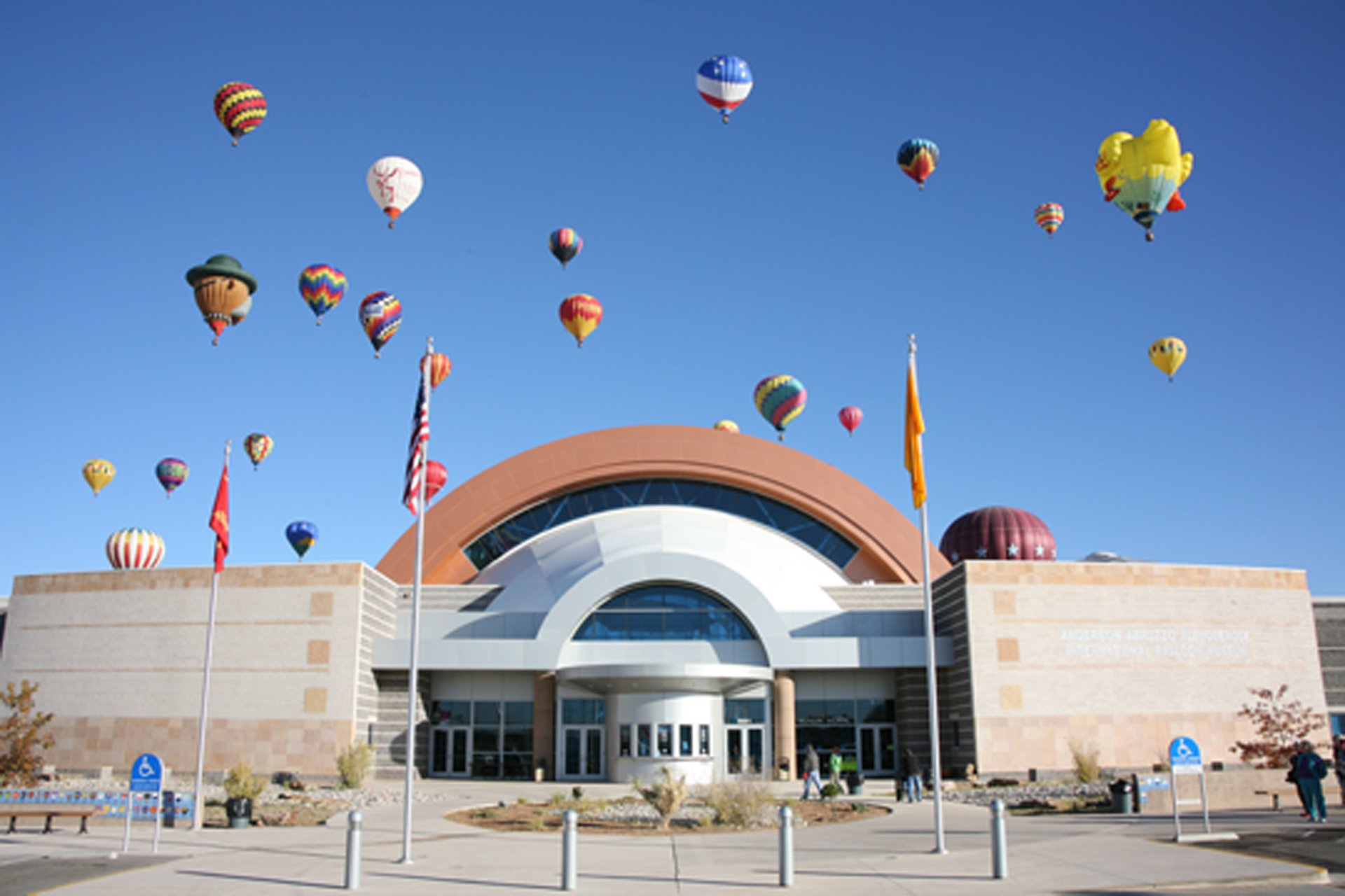 hot-air balloons over building entrance
