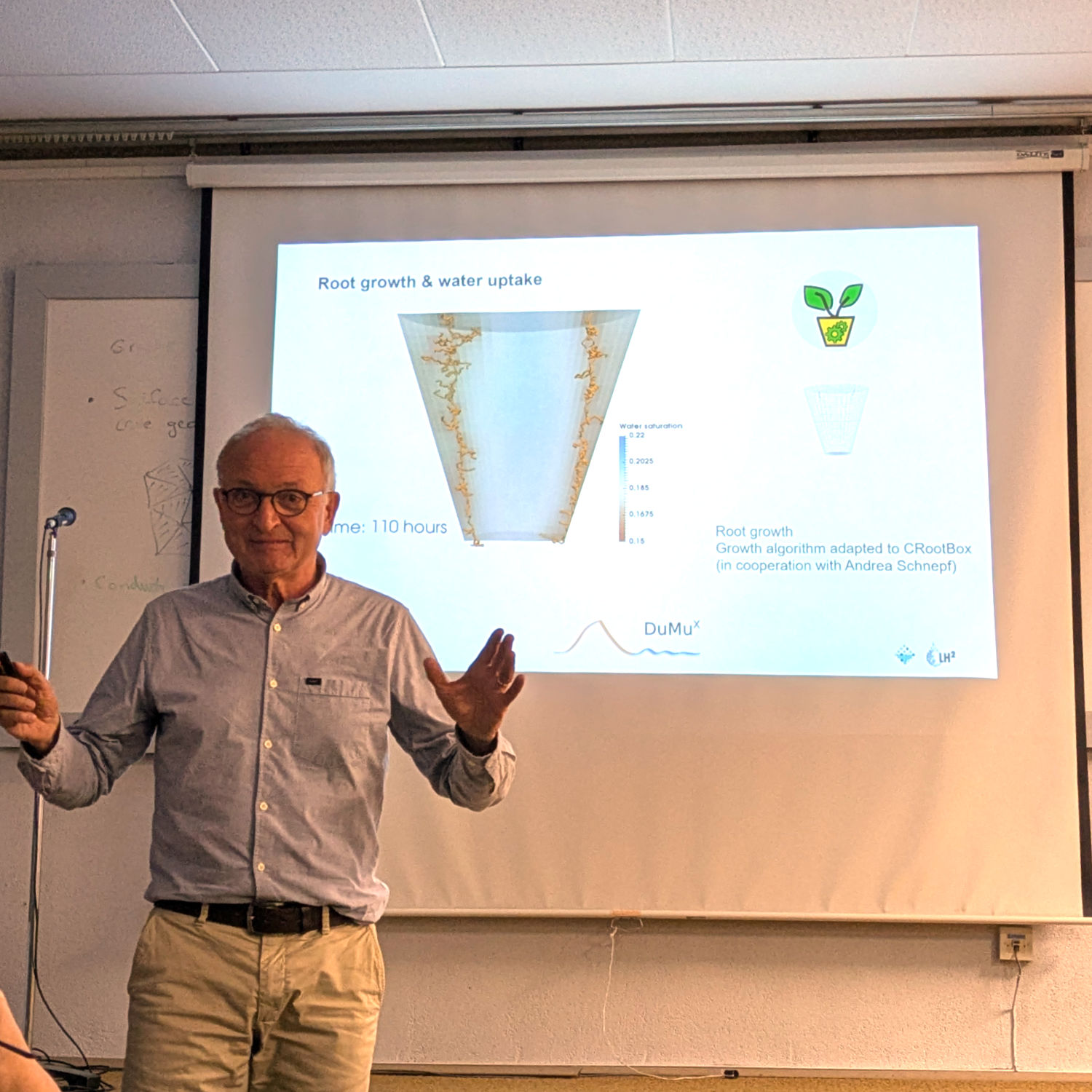 Rainer Helmig standing in front of screen