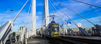 Image of a street train crossing a bridge in Bucharest, Romania